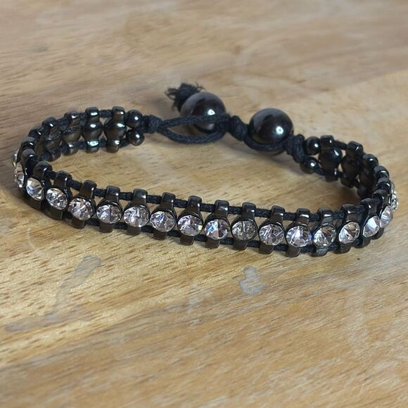 Black corded bracelet with white silver tone rhinestones with beaded closure - Picture 2 of 6